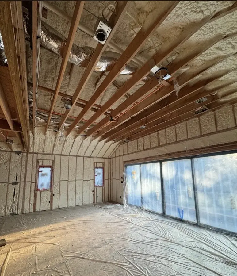 Interior walls and ceiling insulated with spray foam during new construction in Cherokee